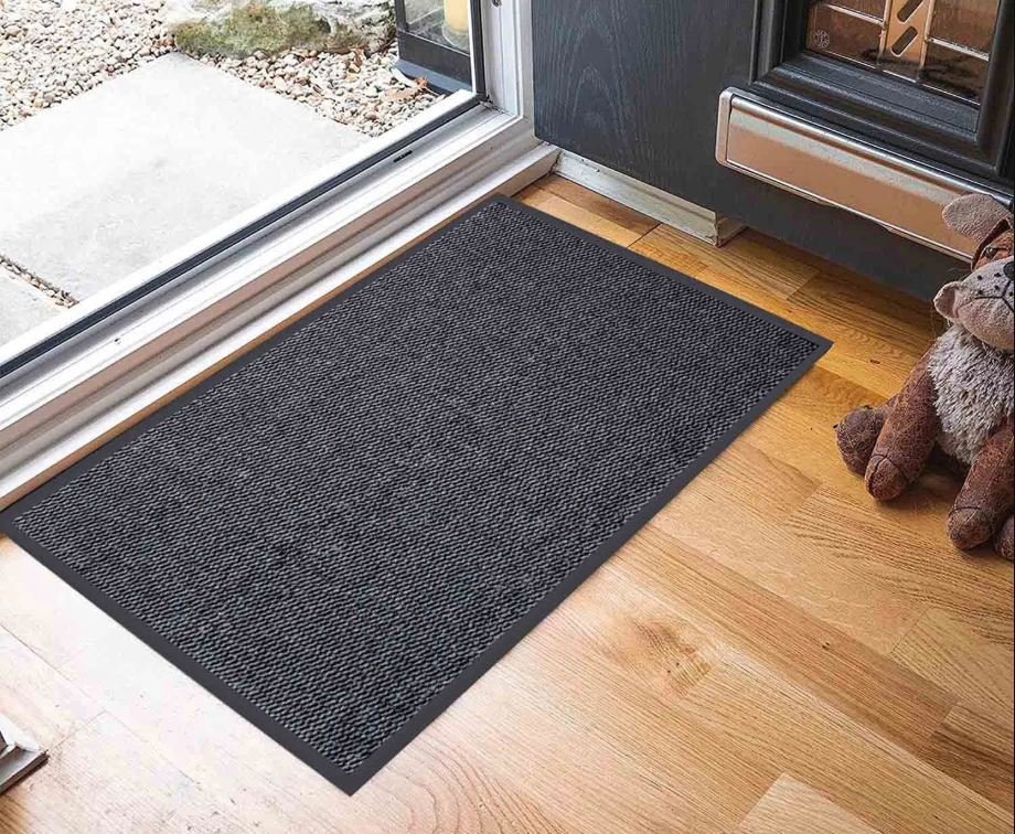 High-quality rubber-backed doormat at a modern UK home entrance, showing durability and effectiveness in trapping dirt for busy UK entrances.