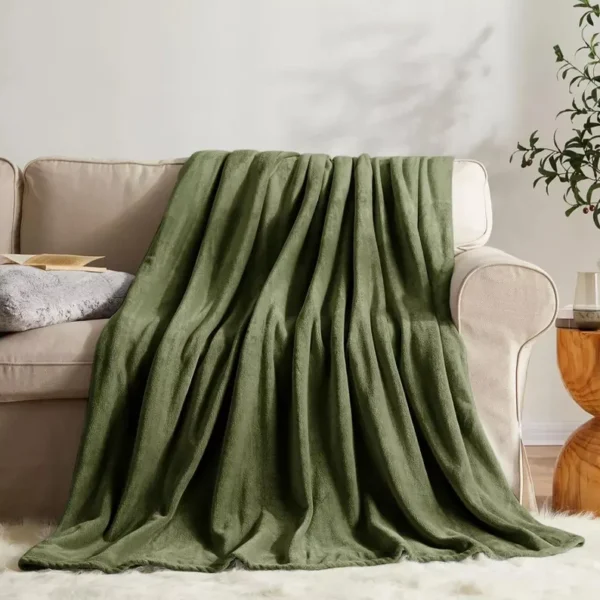Soft green faux fur throw with plush fleece underside, adding style and comfort to your home décor.
