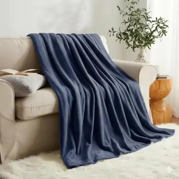 Elegant navy blue faux fur throw with reversible fleece, perfect for a luxurious and cosy feel.