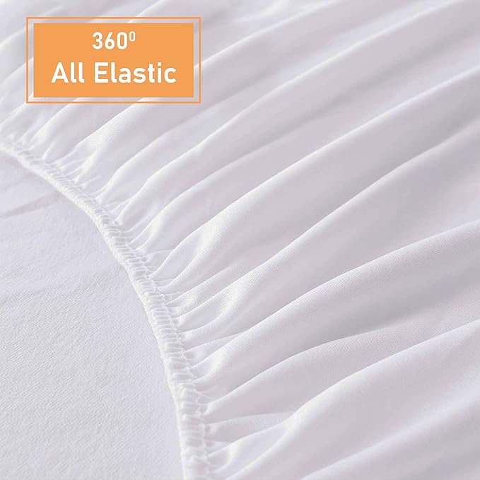 Close up of white terry towel mattress protector fabric and fitted edge