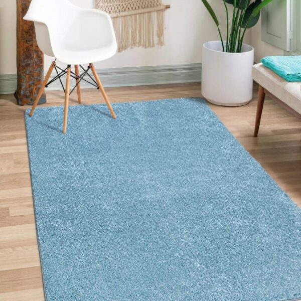 Aqua Verona Thick Shaggy Rug in aqua blue in a living room Rugstars UK