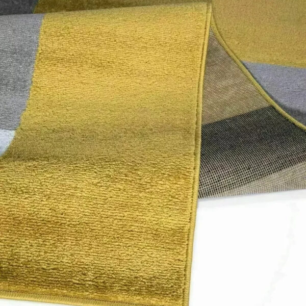 Folded corner of Beige Brown Kilas Geometric Rug showing pile and backing Rugstars UK
