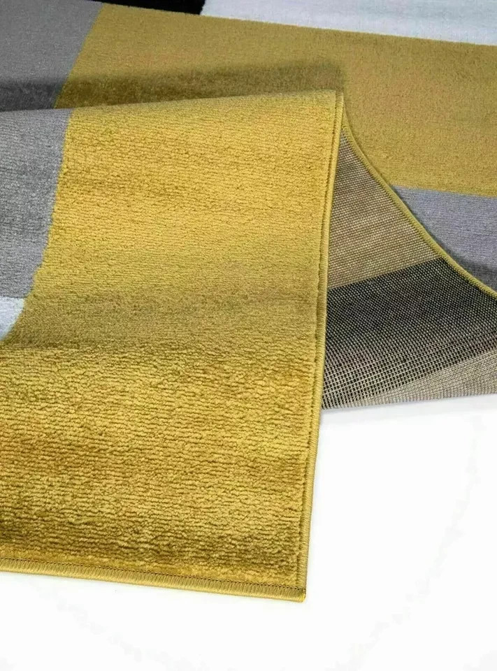 Folded corner of Beige Brown Kilas Geometric Rug showing pile and backing Rugstars UK