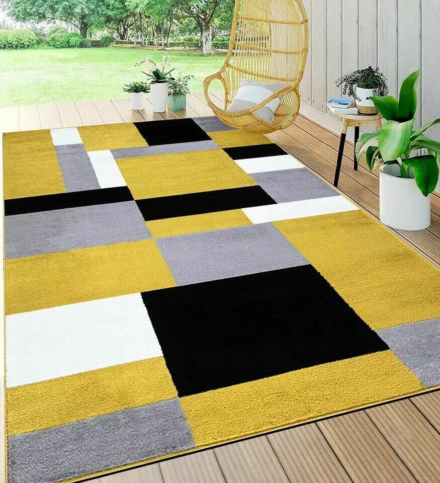 Beige Brown Kilas Modern Geometric Rug with mustard, black, grey and white blocks in a bright room Rugstars UK