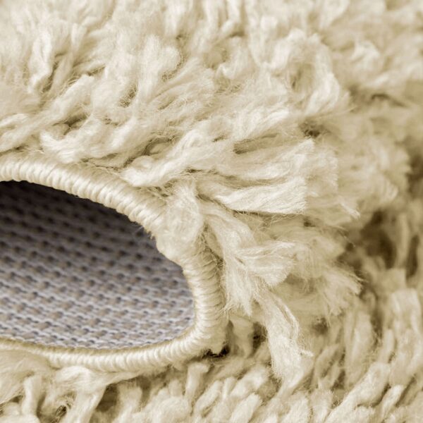 Beige Verona Thick Shaggy Rug folded corner showing the backing Rugstars UK