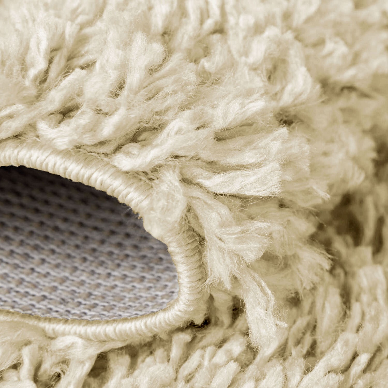 Beige Verona Thick Shaggy Rug folded corner showing the backing Rugstars UK