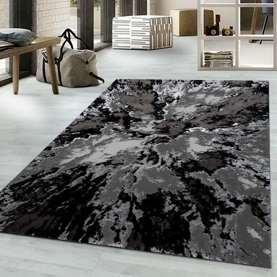 Black Grey Harlo Abstract Area Rug in black and grey in a living room Rugstars UK