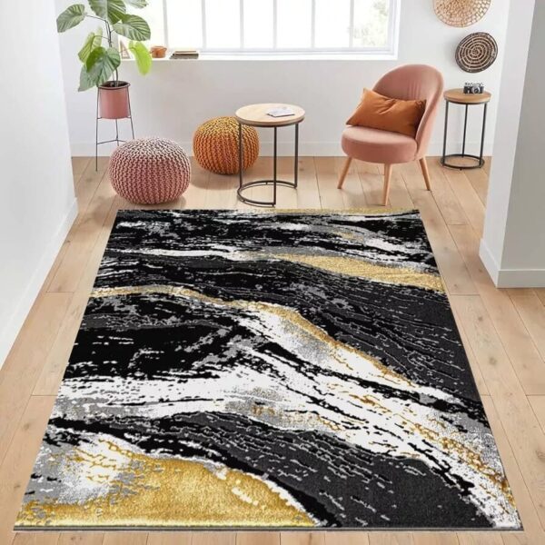 Black Jeze Modern Distressed Rug in black, grey and gold in a room setting Rugstars UK