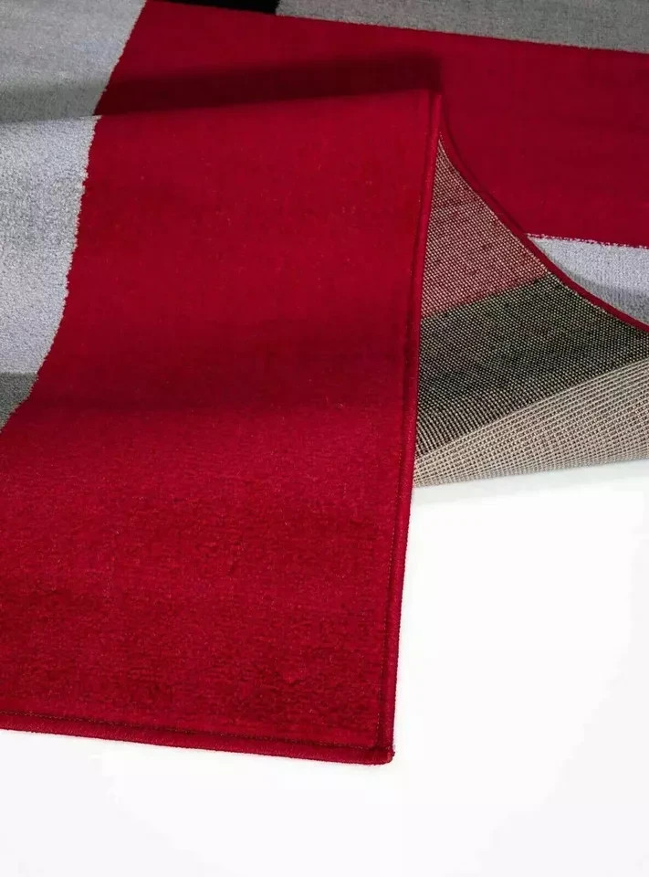 Folded corner of Black Red Kilas Geometric Rug showing pile and backing Rugstars UK