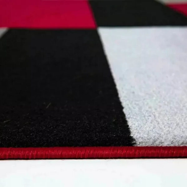 Close up of Black Red Kilas Geometric Rug carved pile Rugstars UK