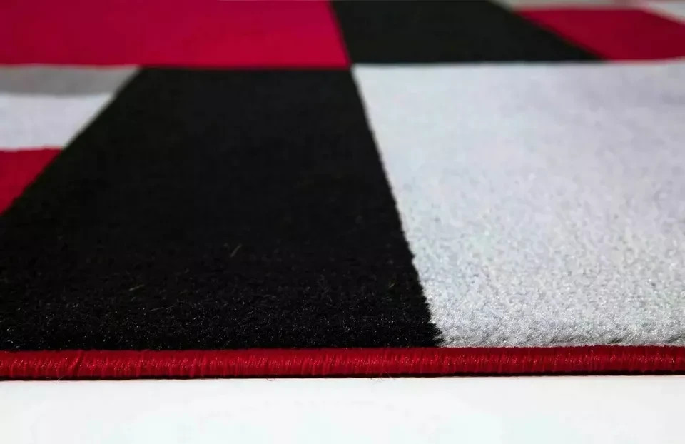 Close up of Black Red Kilas Geometric Rug carved pile Rugstars UK