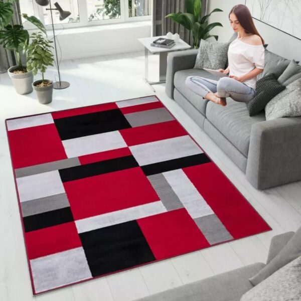 Black Red Kilas Modern Geometric Rug in a lounge beside a sofa Rugstars UK