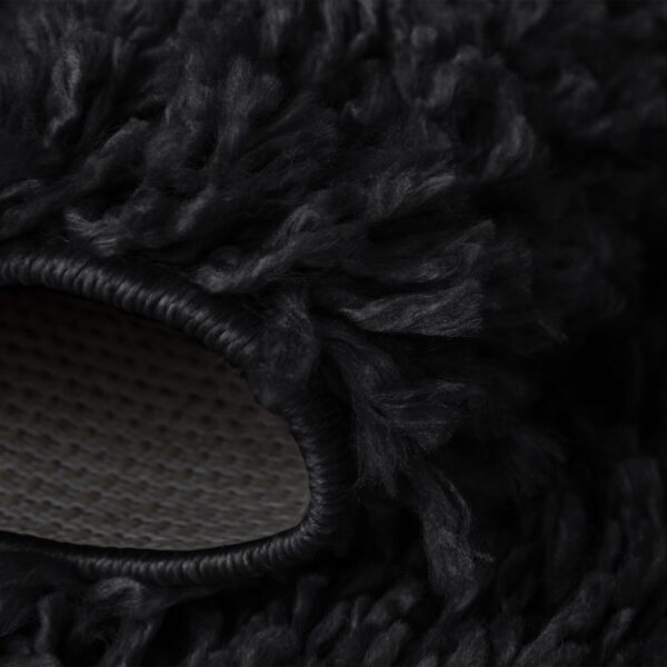 Black Verona Thick Shaggy Rug folded corner showing the backing Rugstars UK