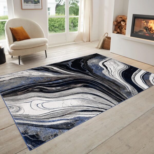 Blue Gant Marble Effect Rug in navy, black and grey in a bright room setting Rugstars UK