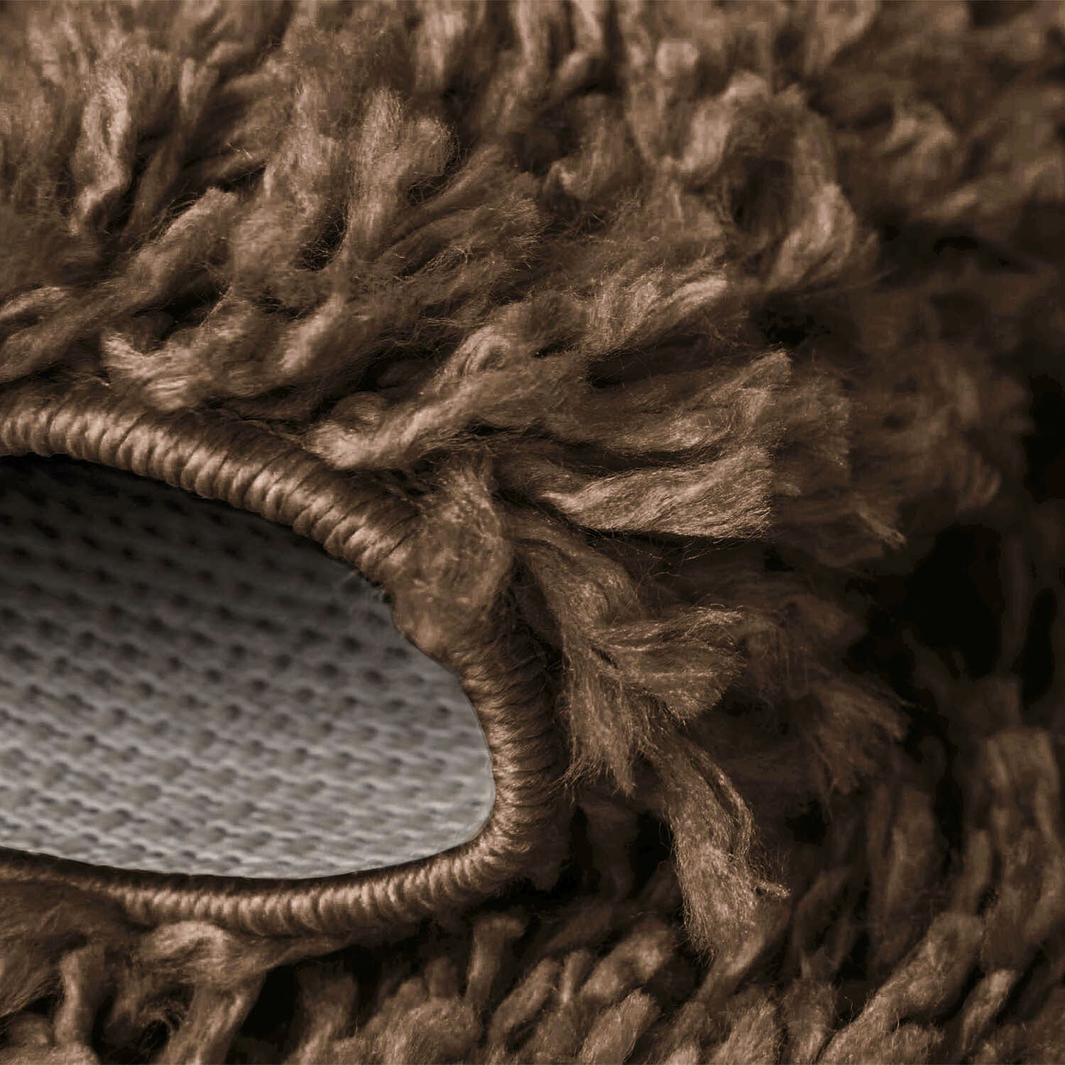Coffee Verona Thick Shaggy Rug folded corner showing the backing Rugstars UK