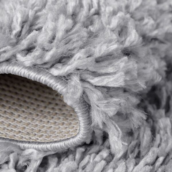 Light Grey Verona Thick Shaggy Rug folded corner showing the backing Rugstars UK