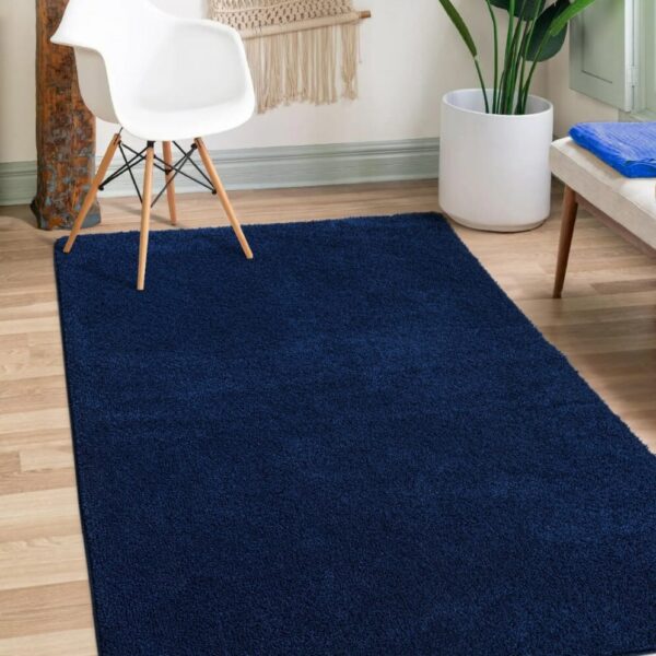Navy Verona Thick Shaggy Rug in navy blue in a living room Rugstars UK