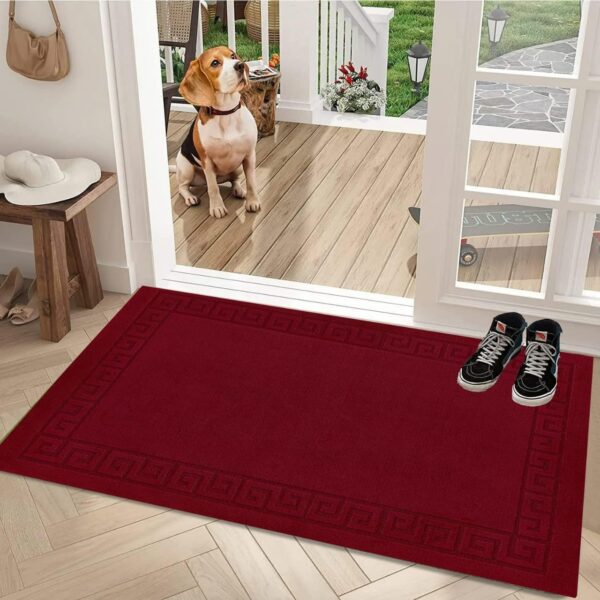 Plain Red Kilas Rug as a door mat by a glazed door Rugstars UK