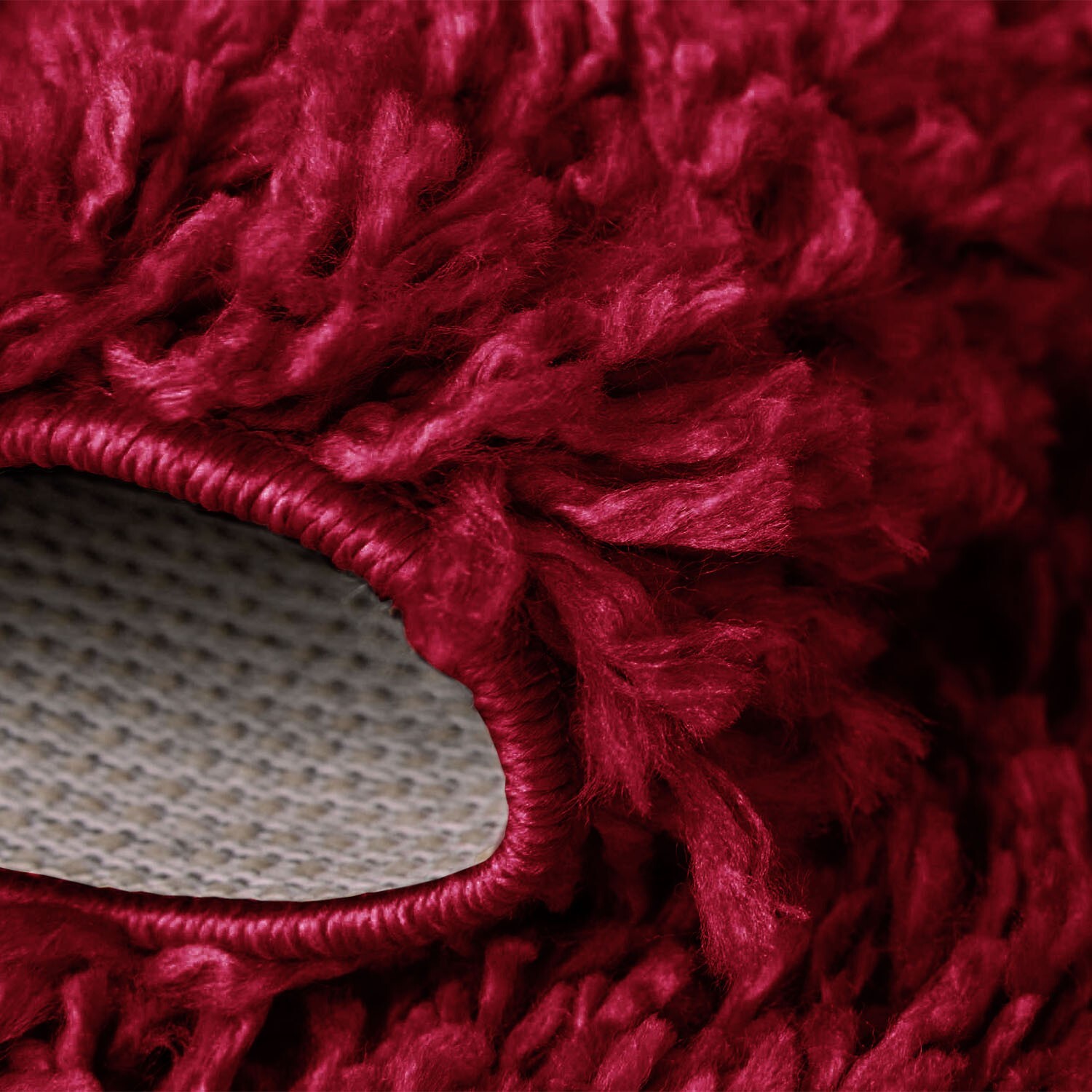 Red Verona Thick Shaggy Rug folded corner showing the backing Rugstars UK