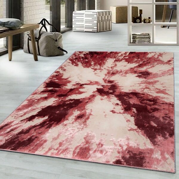 Rose Harlo Abstract Area Rug in pink, red and cream in a living room Rugstars UK