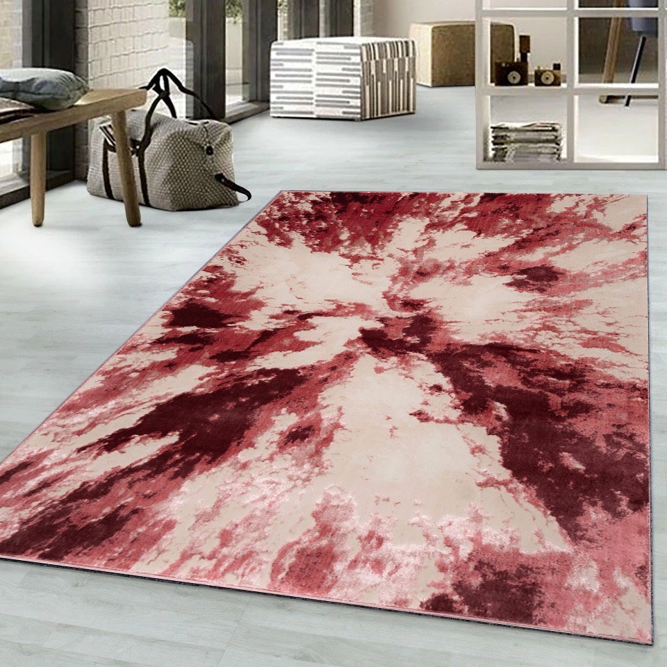 Rose Harlo Abstract Area Rug in pink, red and cream in a living room Rugstars UK