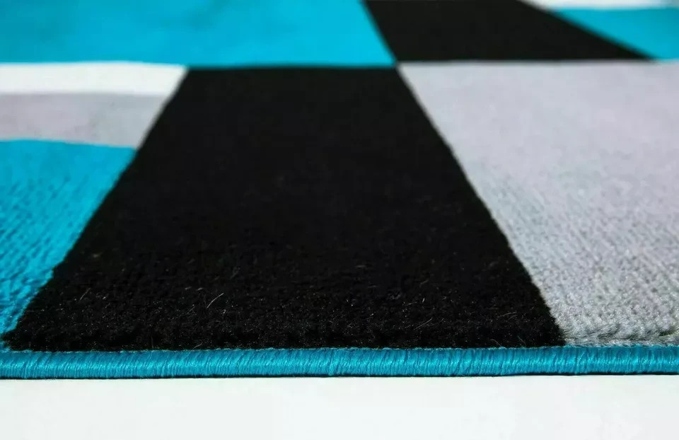 Close up of Teal Black Kilas Geometric Rug carved pile Rugstars UK