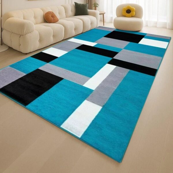 Teal Black Kilas Modern Geometric Rug with teal, black, grey and white blocks in a living room Rugstars UK