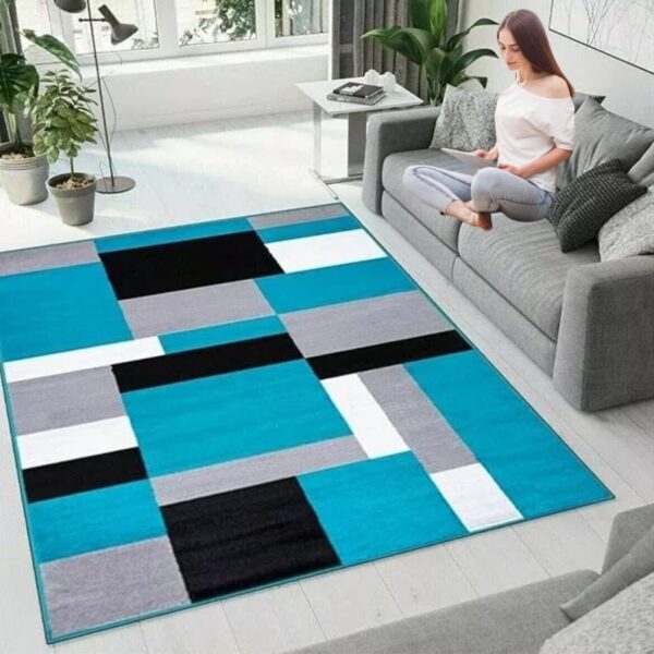 Teal Black Kilas Modern Geometric Rug in a lounge beside a sofa Rugstars UK