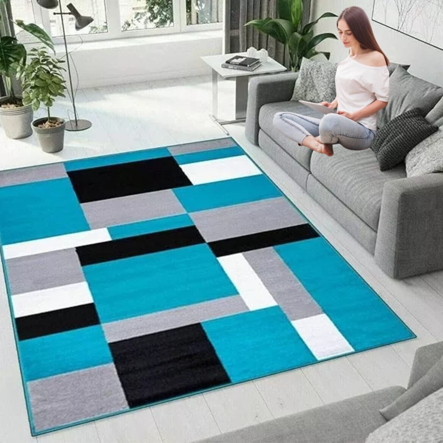 Teal Black Kilas Modern Geometric Rug in a lounge beside a sofa Rugstars UK